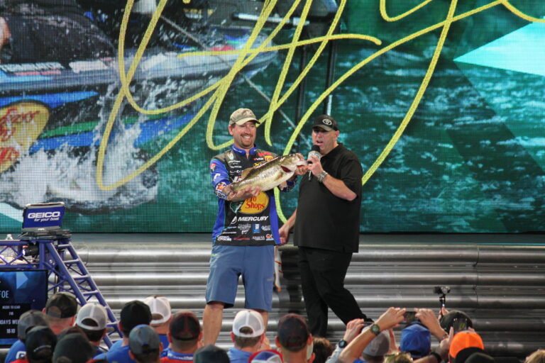 Ott DeFoe holding a Lake Conroe largemouth bass