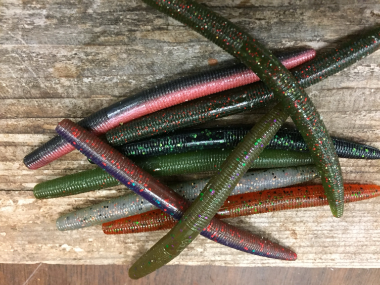 Assorted soft-plastic stick worms in multiple colors