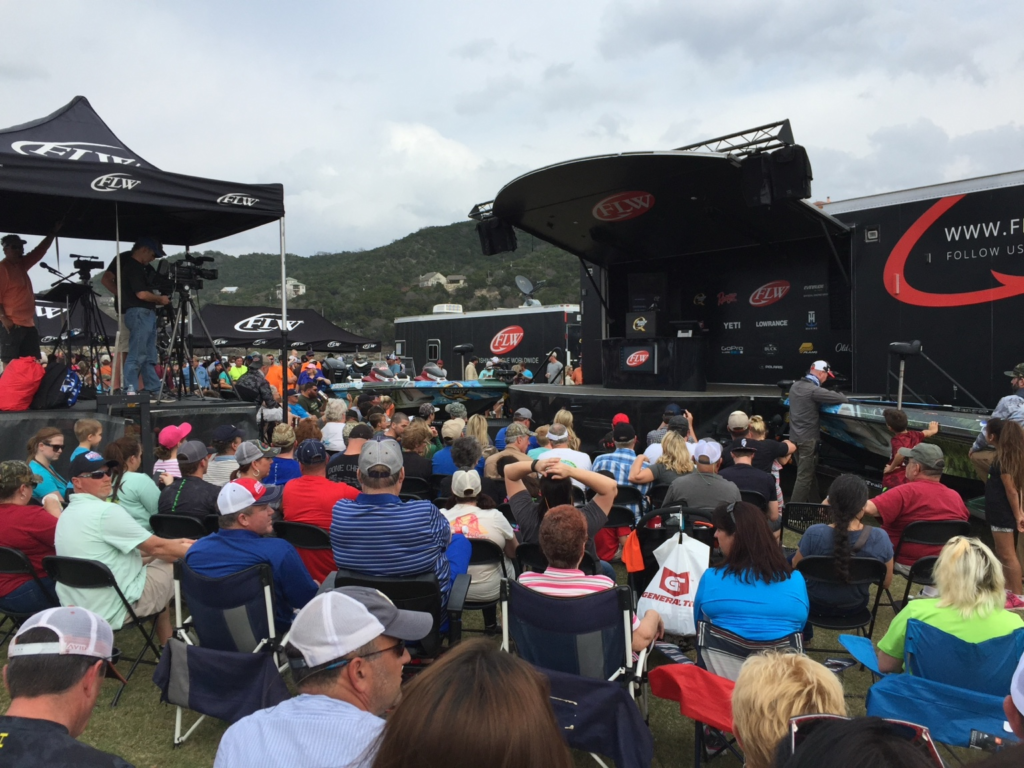 Crowd watching an FLW bass-fishing tournament stage